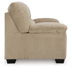 Beige corduroy loveseat with rolled armrest, thick back cushion, and dark legs