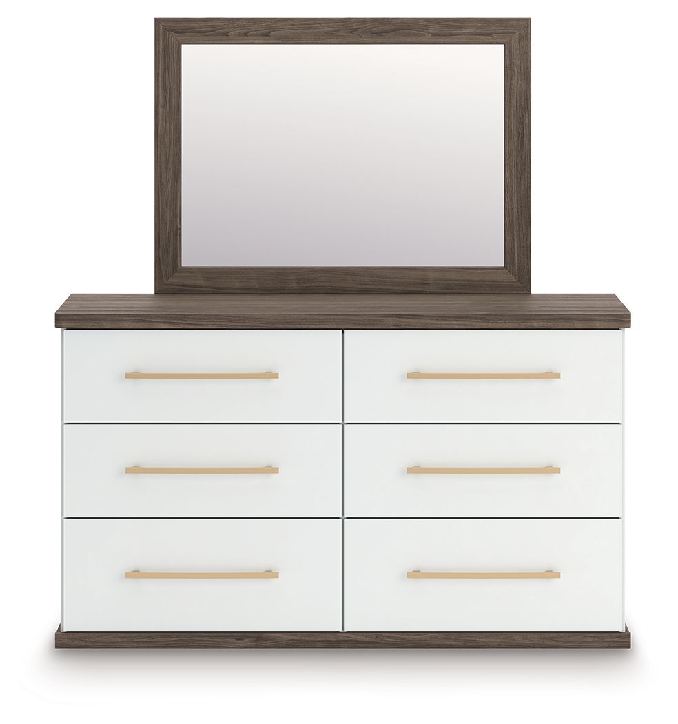 Six-drawer dresser with mirror, white drawer fronts, warm wood top and frame, gold pulls.