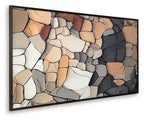 Wide framed abstract stone wall art print with black, tan, and white mosaic shapes