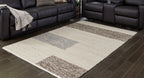 Barus rug with beige center and gray geometric bands on the corners
