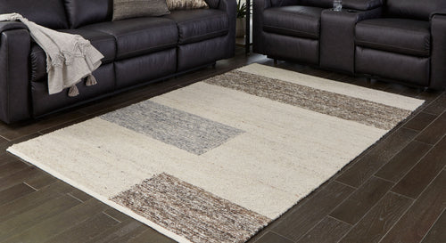 Barus rug with beige center and gray geometric bands on the corners