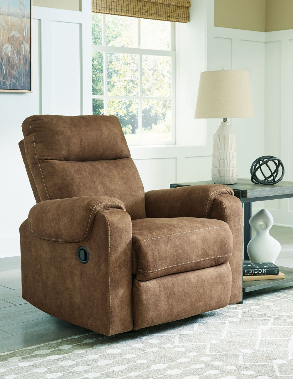 Brindle fabric rocker recliner with reclined seat and padded footrest
