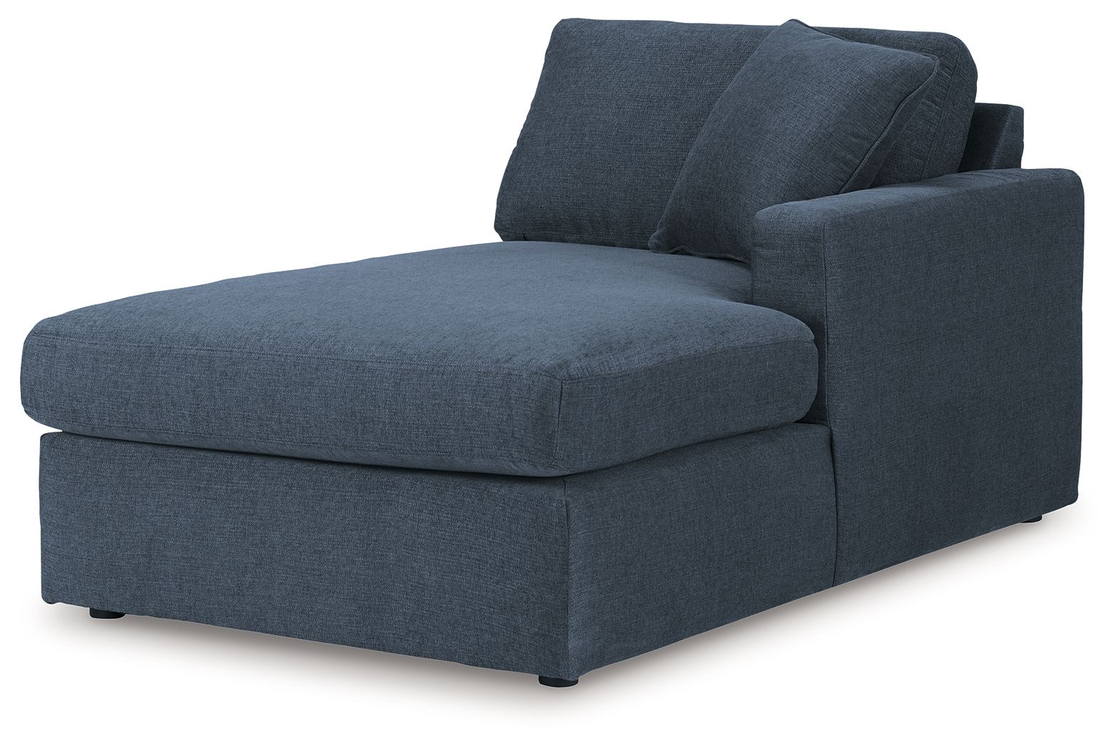 Dark blue upholstered corner chaise with wide armrest and two back cushions