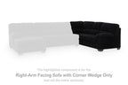Dark sofa section with right-facing corner wedge, tufted cushions and wide armrest