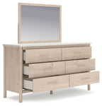 Cadmori two-tone dresser with mirror, drawers pulled open on light wood base