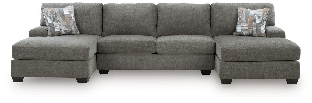 Gray sectional sofa with three-seat back and chaise arms, includes accent pillows