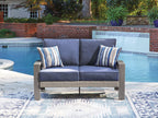 Blue loveseat with gray frame, squared armrests and two striped throw pillows