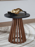 Round end table with dark top and warm brown skirted legs, with gold decor item