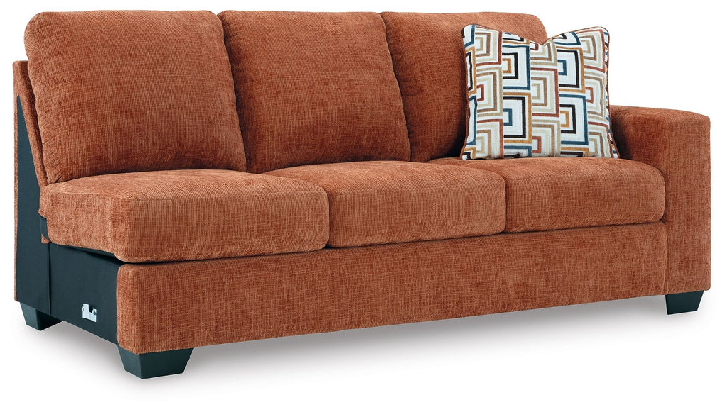 Rust orange RAF sofa with tufted back cushions and three seat cushions