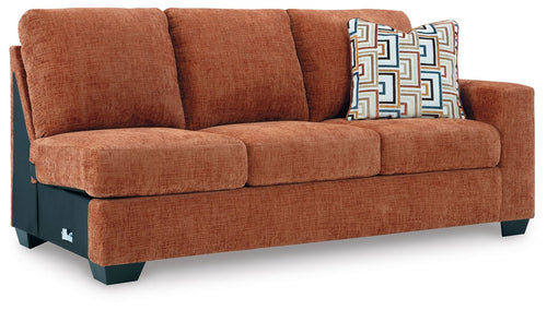 Rust orange RAF sofa with tufted back cushions and three seat cushions