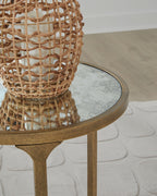 Round side table corner with light gray stone top and gold metal frame