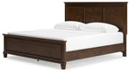 Dark brown panel bed with tall paneled headboard and white upholstered mattress