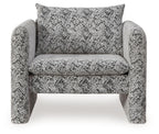 Upholstered accent chair with black-and-white woven pattern, wide arms and back
