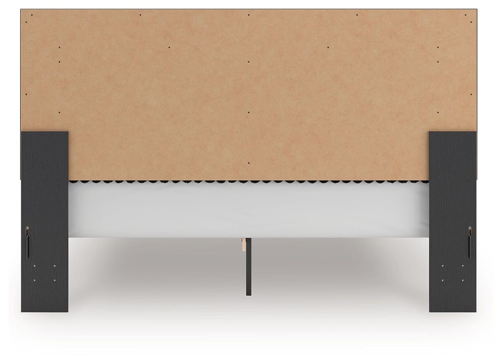 Upholstered panel platform bed footboard view, dark frame legs with upholstered panel