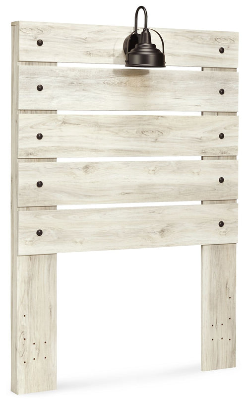 Beige panel headboard with horizontal plank panels and centered black lamp