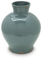 Blue ceramic vase with glossy finish, rounded silhouette, and orange speckled base accents