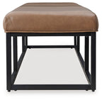 Caramel brown accent bench with tufted cushion and black metal base