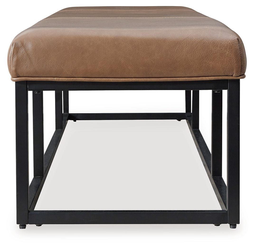 Caramel brown accent bench with tufted cushion and black metal base