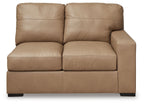 Toffee-brown leather loveseat with two front seat cushions, wide arms, and back pillows