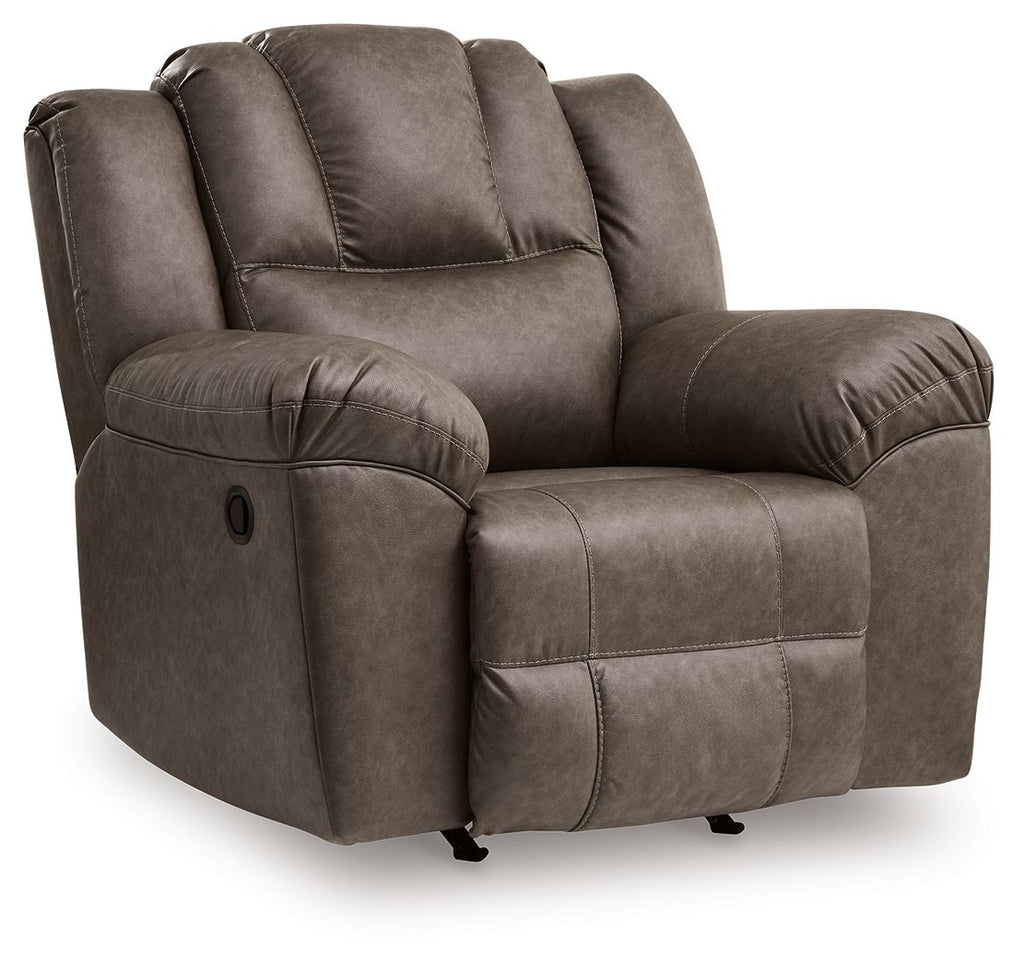 Dark brown rocker recliner chair with cushioned arms, tufted back, and side control