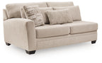Beige fabric loveseat with two front cushions, rolled arms, dark legs, throw pillows
