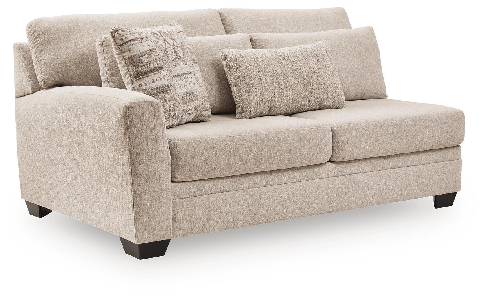 Beige fabric loveseat with two front cushions, rolled arms, dark legs, throw pillows