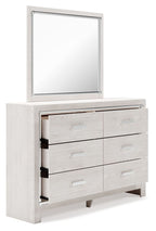 White dresser with mirror, side view with partially open drawer compartments