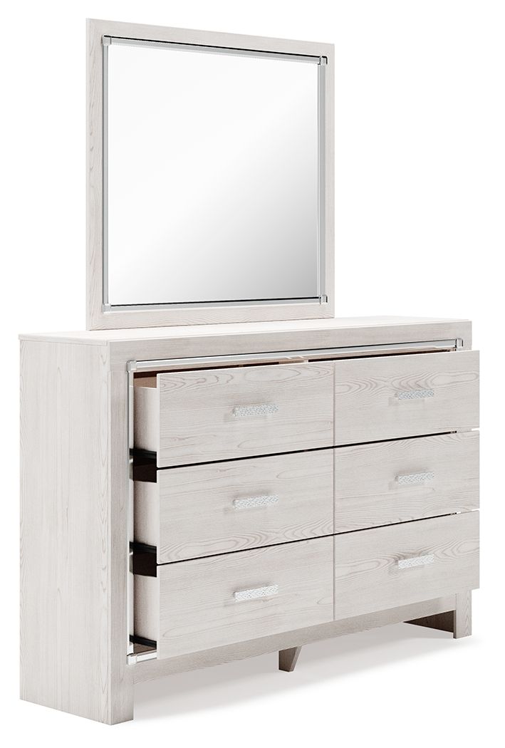 White dresser with mirror; open drawers reveal interior shelves and cubbies