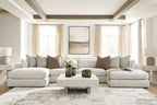 Beige sectional sofa with chaise, cushioned back and arms, styled with pillows and a coffee table