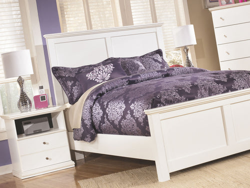 White one-drawer night stand with open shelf beside bed, round metal knob