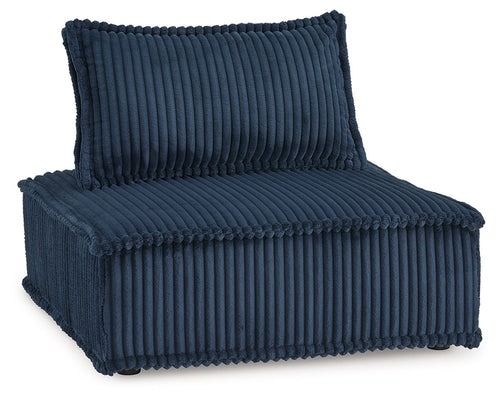 Blue ribbed accent chair with padded arms and high back cushion