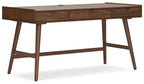Light brown home office desk, side view, with 3 drawers and angled legs