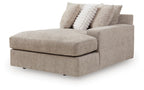 Right-facing corner chaise with track arms, padded seat, and two accent pillows