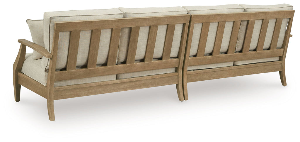 Beige loveseat frame with armrests and upholstered seat cushions