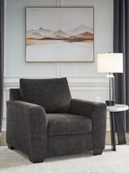 Loreo chair in dark gray upholstered fabric with tall back and padded armrests