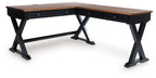 Home office desk with brown wood top, dark X-frame legs, and drawer panel