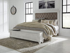 Upholstered panel bed in white with tufted taupe headboard and white frame