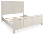 White panel bed with vertical slat headboard and side rails, low-profile frame
