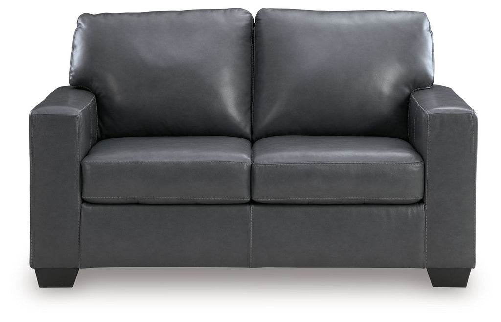 Gray loveseat with squared arms, two back cushions, and padded seat panels