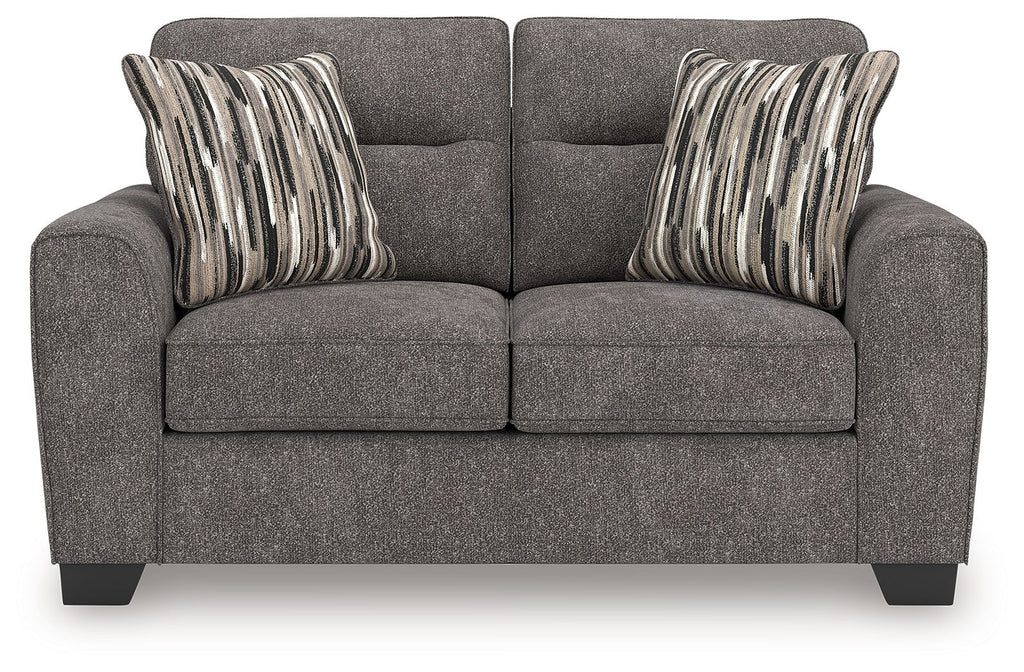 Dark gray upholstered loveseat with two seat cushions and front panel seams