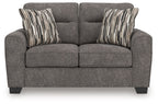 Dark gray upholstered loveseat with two seat cushions and front panel seams