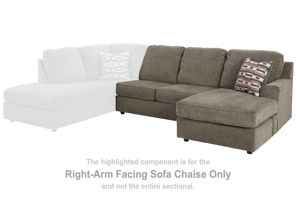 Gray sofa chaise with chaise section, squared back cushions, and patterned throw pillow