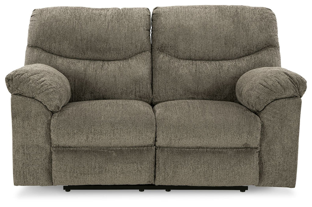 Reclining loveseat in dark gray fabric with rounded armrests and split seat