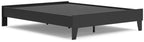 Platform bed with dark frame and black slatted support panel, top view