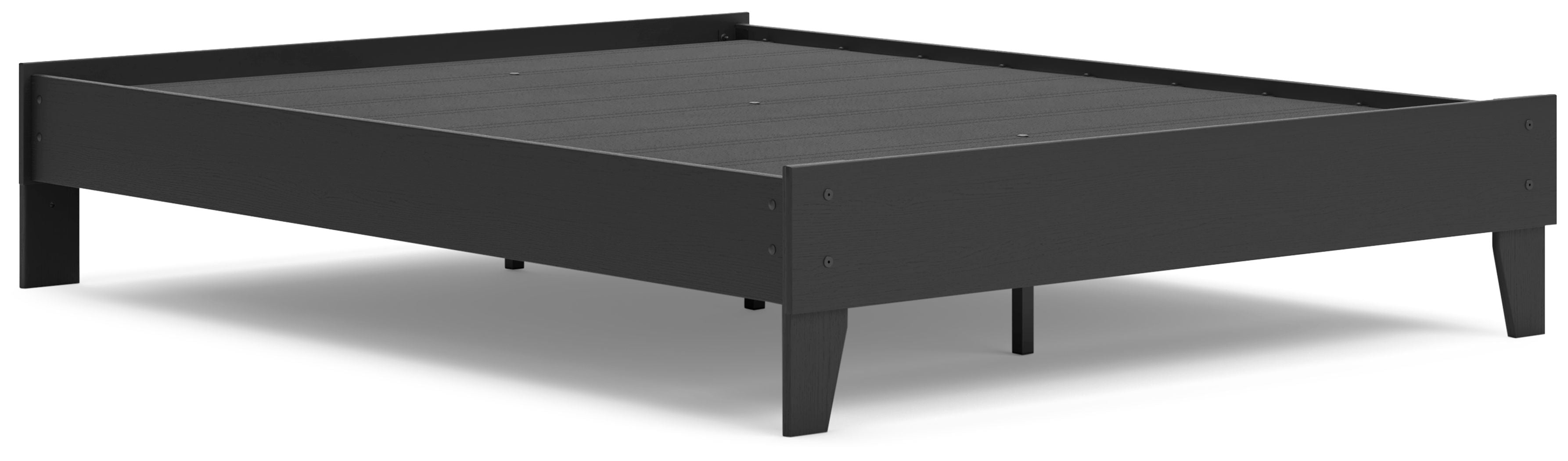 Platform bed with dark frame and black slatted support panel, top view