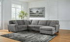 Gray sectional sofa with corner chaise and patterned pillows, wide seat and chaise cushions