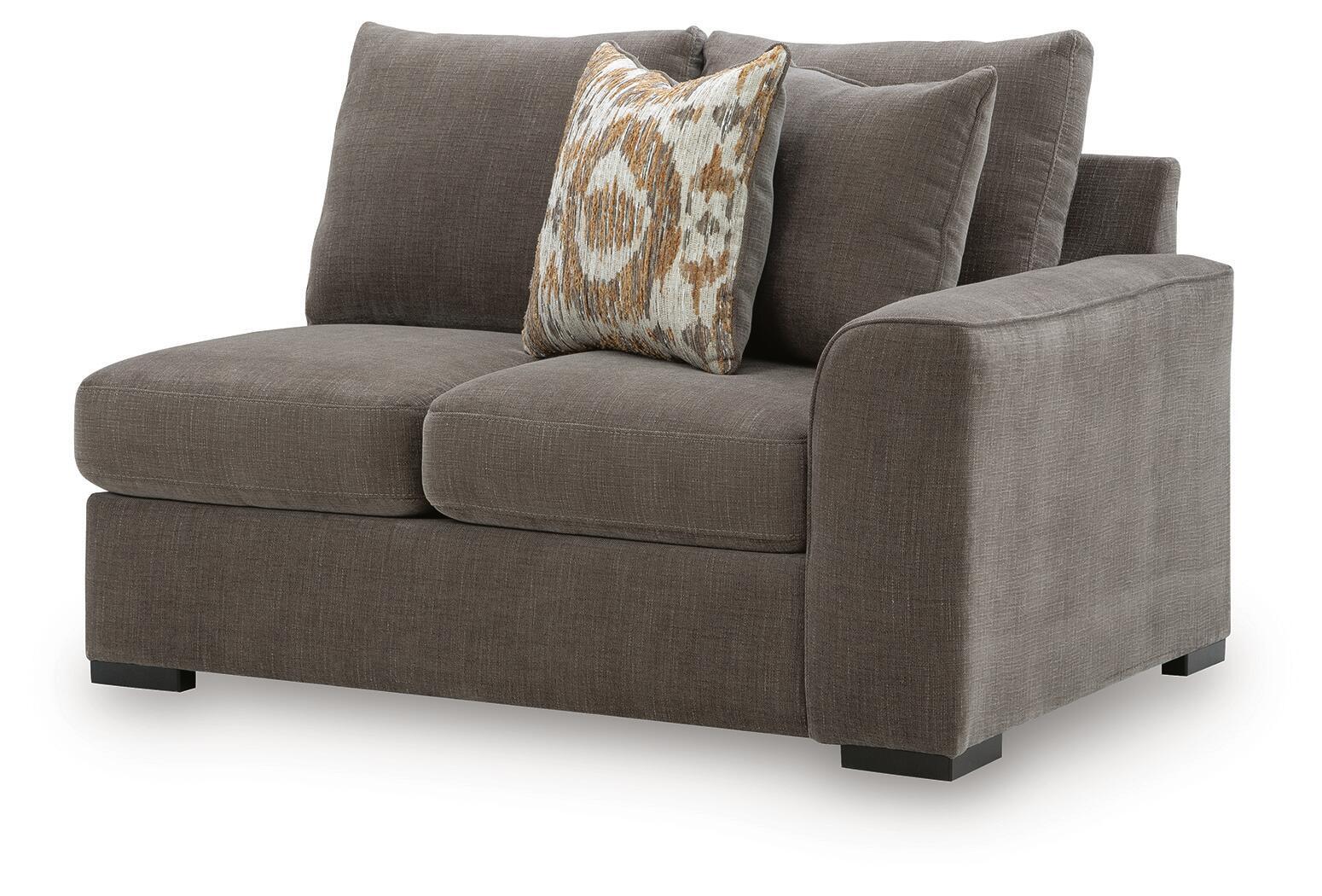 Gray fabric right-arm loveseat with two throw pillows and dark wooden legs.