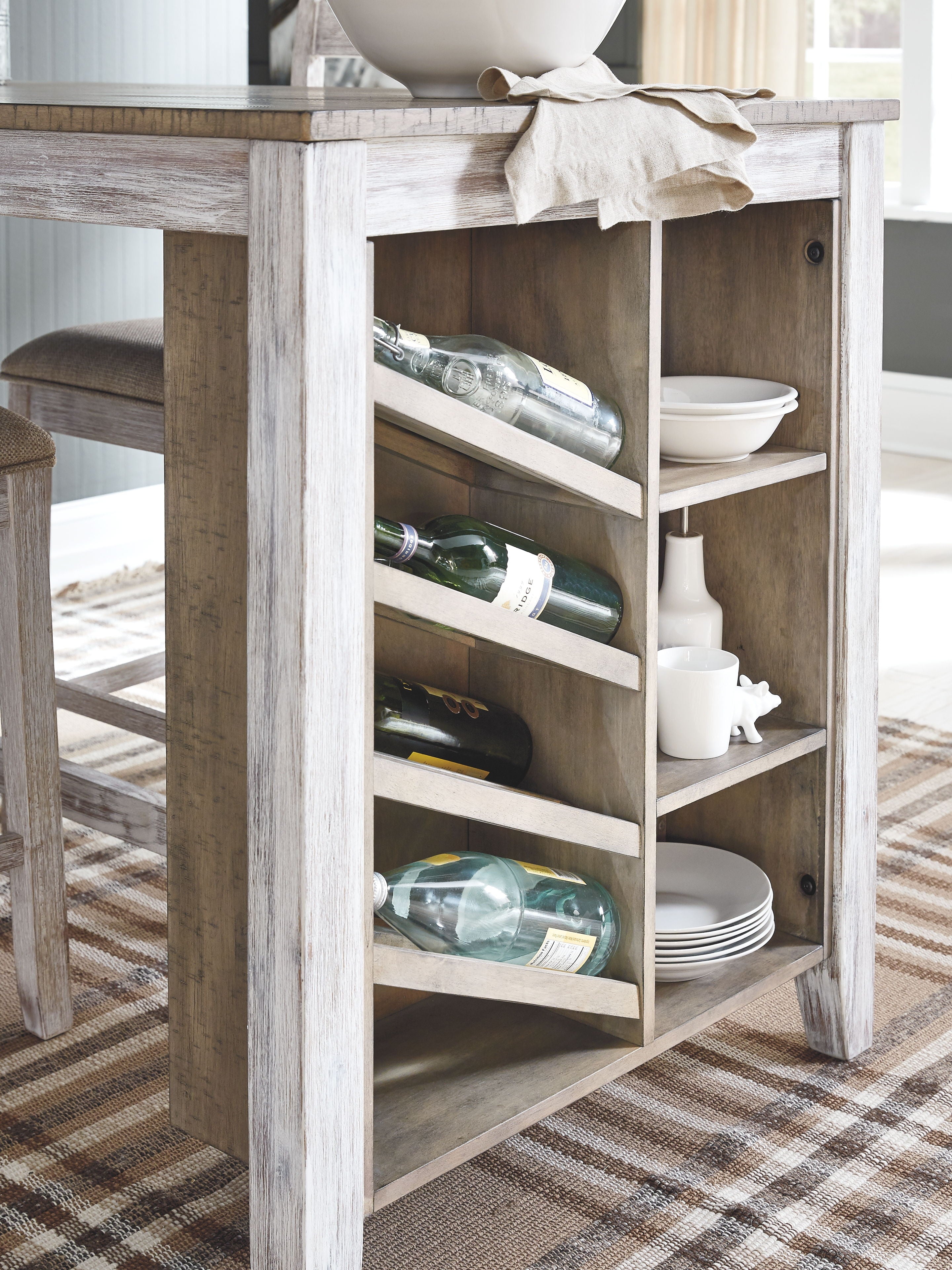Open storage compartment with bottle holders under a rectangular counter table