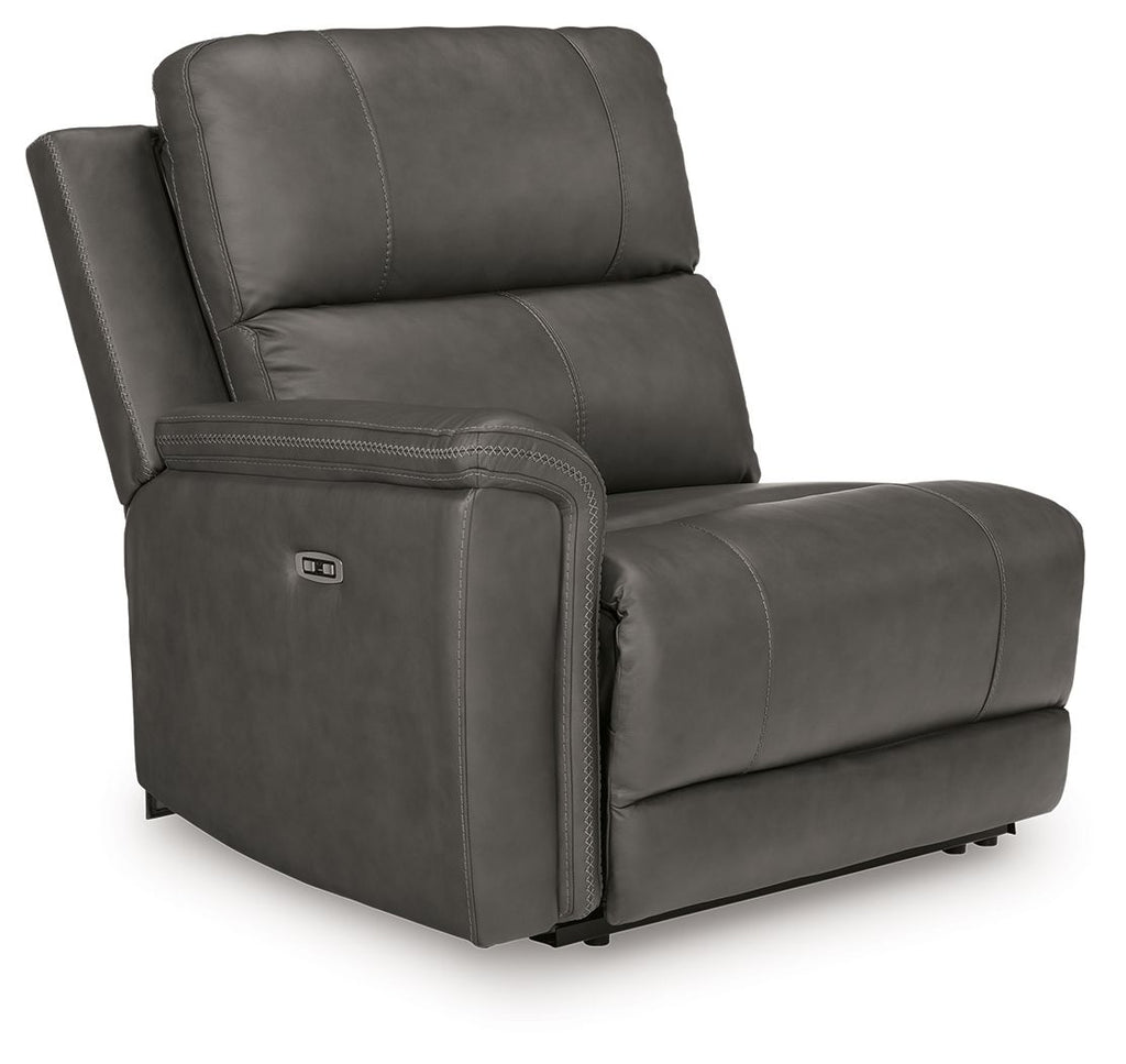 Power wall recliner chair in dark gray upholstery with padded armrests and seams