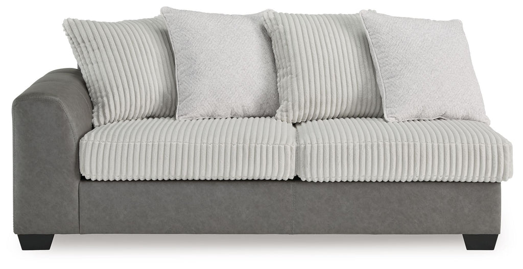 Grey sofa bed with ribbed seat, striped back pillows, and three back cushions